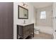 Updated bathroom featuring vanity with a marble countertop, and a tub with white subway tile surround at 5700 W 28Th Ave # 6, Wheat Ridge, CO 80214