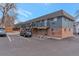 Multi-unit apartment building with ample parking spaces and brick and siding facade at 5700 W 28Th Ave # 6, Wheat Ridge, CO 80214