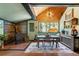 Charming dining area with a unique wood-burning stove and views of the outdoors at 7364 Rossman Gulch Rd, Morrison, CO 80465