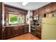 Well-designed kitchen with wooden cabinets, stainless steel appliances, and a stylish mosaic backsplash at 7364 Rossman Gulch Rd, Morrison, CO 80465