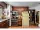 Functional kitchen featuring wood cabinets, stainless steel appliances, and a retro refrigerator at 7364 Rossman Gulch Rd, Morrison, CO 80465