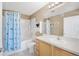Bright bathroom featuring a shower over tub, a single sink vanity, and fresh white tiling at 15475 Andrews Dr # 314, Denver, CO 80239