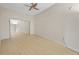 Bedroom with light-colored wooden floors and a mirror closet at 15475 Andrews Dr # 314, Denver, CO 80239