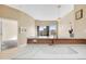 Well-lit kitchen featuring a breakfast bar with stone countertops at 15475 Andrews Dr # 314, Denver, CO 80239