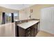 Modern kitchen with stainless steel appliances and breakfast bar at 15475 Andrews Dr # 314, Denver, CO 80239