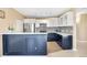 Contemporary kitchen design with contrasting cabinetry and stainless steel appliances at 15475 Andrews Dr # 314, Denver, CO 80239