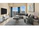 Inviting living space with a large window, stylish furniture, and plenty of natural light at 15475 Andrews Dr # 314, Denver, CO 80239