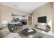 Comfortable living area with a view into the modern kitchen, featuring sleek countertops at 15475 Andrews Dr # 314, Denver, CO 80239