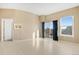 Open living room featuring lots of windows allowing for natural light at 15475 Andrews Dr # 314, Denver, CO 80239