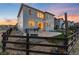A spacious backyard, fenced with a patio area, seating, and outdoor lighting at 11582 Jimenez St, Parker, CO 80134