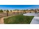 Large backyard with a concrete patio and fence, creating a private outdoor space at 11582 Jimenez St, Parker, CO 80134