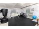 A home gym in an unfinished basement provides a dedicated space for fitness and exercise at 11582 Jimenez St, Parker, CO 80134
