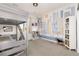 A bedroom featuring a lofted bed, city themed wall mural and ample storage spaces at 11582 Jimenez St, Parker, CO 80134