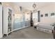 A stylish bedroom features a mountain mural, built-in bed storage, and a well-lit space with shelving at 11582 Jimenez St, Parker, CO 80134