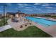 Community pool area with lounge chairs, perfect for relaxation and recreation at 11582 Jimenez St, Parker, CO 80134