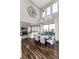 Dining room with high ceilings, chandelier, and views of the backyard and adjacent Gathering room at 11582 Jimenez St, Parker, CO 80134