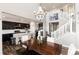 Open concept dining area showing the kitchen, staircase and main level in a modern floorplan at 11582 Jimenez St, Parker, CO 80134
