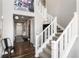 Spacious entryway featuring a staircase, hardwood floors, and a stylish front door at 11582 Jimenez St, Parker, CO 80134