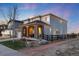 Charming two-story home with stone accents and a cozy covered porch, fenced yard, and professional landscape lighting at 11582 Jimenez St, Parker, CO 80134