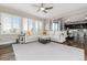 Open living room with large windows and a seamless view of the dining room and kitchen at 11582 Jimenez St, Parker, CO 80134