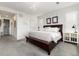 Spacious main bedroom featuring a dark wood bed and a textured accent wall at 11582 Jimenez St, Parker, CO 80134