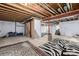 Unfinished basement with open space and exposed ceiling, ready for customization and storage at 20534 E Union Cir, Aurora, CO 80015