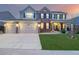 Beautiful two-story home featuring a three-car garage and well-maintained lawn at 20534 E Union Cir, Aurora, CO 80015