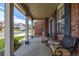 Relaxing front porch featuring comfortable seating and decorative columns, great street view at 20534 E Union Cir, Aurora, CO 80015