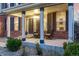 Inviting front porch with stylish chairs and decorative columns, perfect for relaxing at 20534 E Union Cir, Aurora, CO 80015