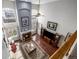 Bright living room with high ceilings, fireplace, large windows, and hardwood floors create a spacious feel at 20534 E Union Cir, Aurora, CO 80015