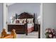 View of the main bedroom showing a wooden bedframe and furnishings, creating a peaceful atmosphere at 20534 E Union Cir, Aurora, CO 80015