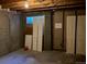 Unfinished basement with exposed ceiling, potential for customization, and window at 5866 W Asbury Pl, Lakewood, CO 80227