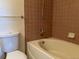 Cozy bathroom with a combined shower and bathtub at 5866 W Asbury Pl, Lakewood, CO 80227