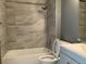 Updated bathroom featuring modern fixtures and stylish tile at 5866 W Asbury Pl, Lakewood, CO 80227