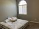 Bedroom featuring a large window with natural light at 5866 W Asbury Pl, Lakewood, CO 80227