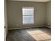 Sunny bedroom with natural light and neutral walls at 5866 W Asbury Pl, Lakewood, CO 80227