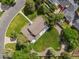 Aerial view of a home with a large backyard, mature trees, and a circular driveway at 6279 E Princeton Ave, Cherry Hills Village, CO 80111