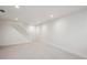 Spacious basement featuring neutral carpet, white trim, and recessed lighting at 6279 E Princeton Ave, Cherry Hills Village, CO 80111