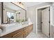 Modern bathroom with dual sinks, white countertops, and contemporary fixtures at 6279 E Princeton Ave, Cherry Hills Village, CO 80111