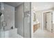 Bathroom featuring a glass shower with gray tile, vanity with double sinks and tile floor at 6279 E Princeton Ave, Cherry Hills Village, CO 80111