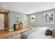 Spacious bedroom features hardwood floors, and a cabinet with a mirror above it at 6279 E Princeton Ave, Cherry Hills Village, CO 80111