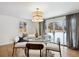 Cozy dining room with stylish lighting and easy access to the backyard at 6279 E Princeton Ave, Cherry Hills Village, CO 80111