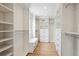 Spacious walk-in closet with custom shelving, drawers, and plenty of storage space at 6279 E Princeton Ave, Cherry Hills Village, CO 80111