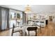 Bright dining room with glass table and backyard access at 6279 E Princeton Ave, Cherry Hills Village, CO 80111