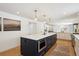 Modern kitchen with blue island and white cabinets at 6279 E Princeton Ave, Cherry Hills Village, CO 80111