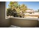 Balcony view overlooking a scenic neighborhood with lush green trees at 6001 S Yosemite St # B206, Greenwood Village, CO 80111