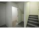Basement access with stairs and door, showcasing a functional storage area at 6001 S Yosemite St # B206, Greenwood Village, CO 80111