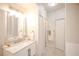 Bathroom features a marble vanity, new mirror, and tile flooring at 6001 S Yosemite St # B206, Greenwood Village, CO 80111