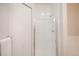 Bright white bathroom featuring a glass-enclosed shower and a clean, modern aesthetic at 6001 S Yosemite St # B206, Greenwood Village, CO 80111