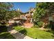 Beautiful two-story condo featuring manicured landscaping and a community courtyard at 6001 S Yosemite St # B206, Greenwood Village, CO 80111